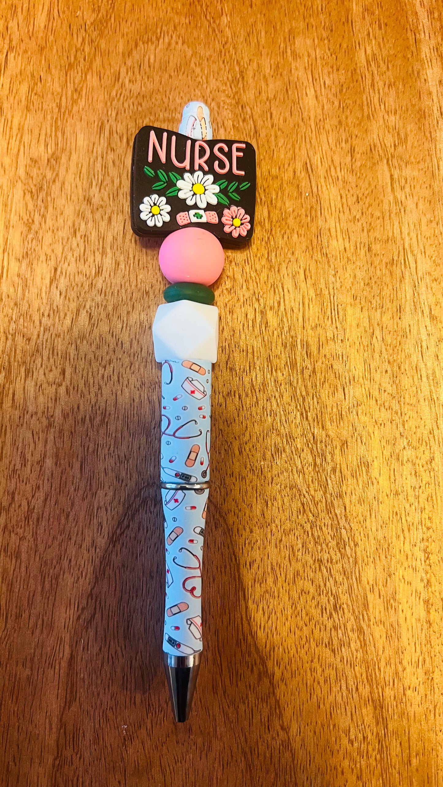 Pen with Nurse Focal Colors: Baby Pink, Black, and Green Lentil