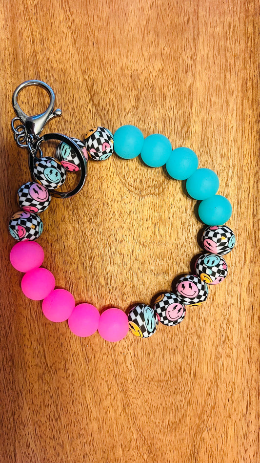 Wristlet Keychain Colors: Checkered Smiley, Pink, and Blue