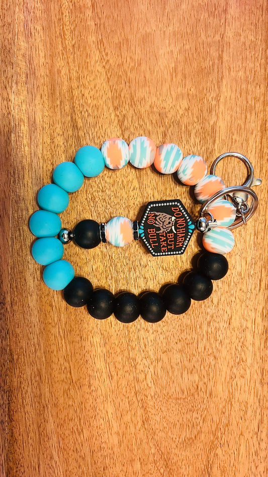 Wristlet AND DO NOT HARM FOCAL Bar Keychain Colors: Turquoise/ Orange Aztec, Black, and Blue