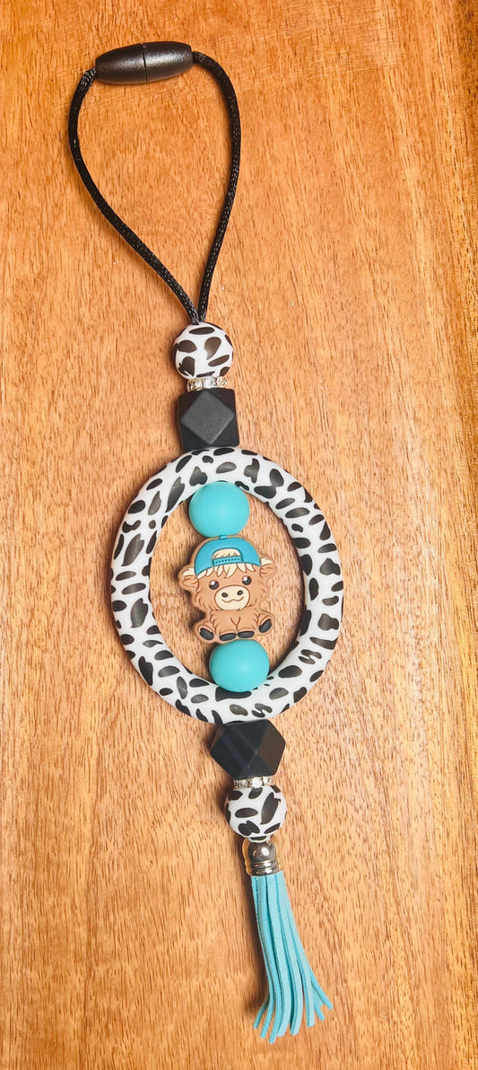 Car Charm with Blue hat Cow Focal Colors: Cow print, Black, and Turquoise